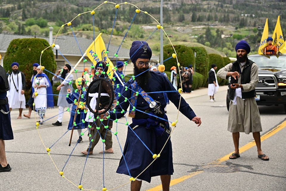 A deft hand, or a finger in this case, controls the spinning rope at the Vaisakhi Parade in Penticton.(Brennan Phillips - Western News)