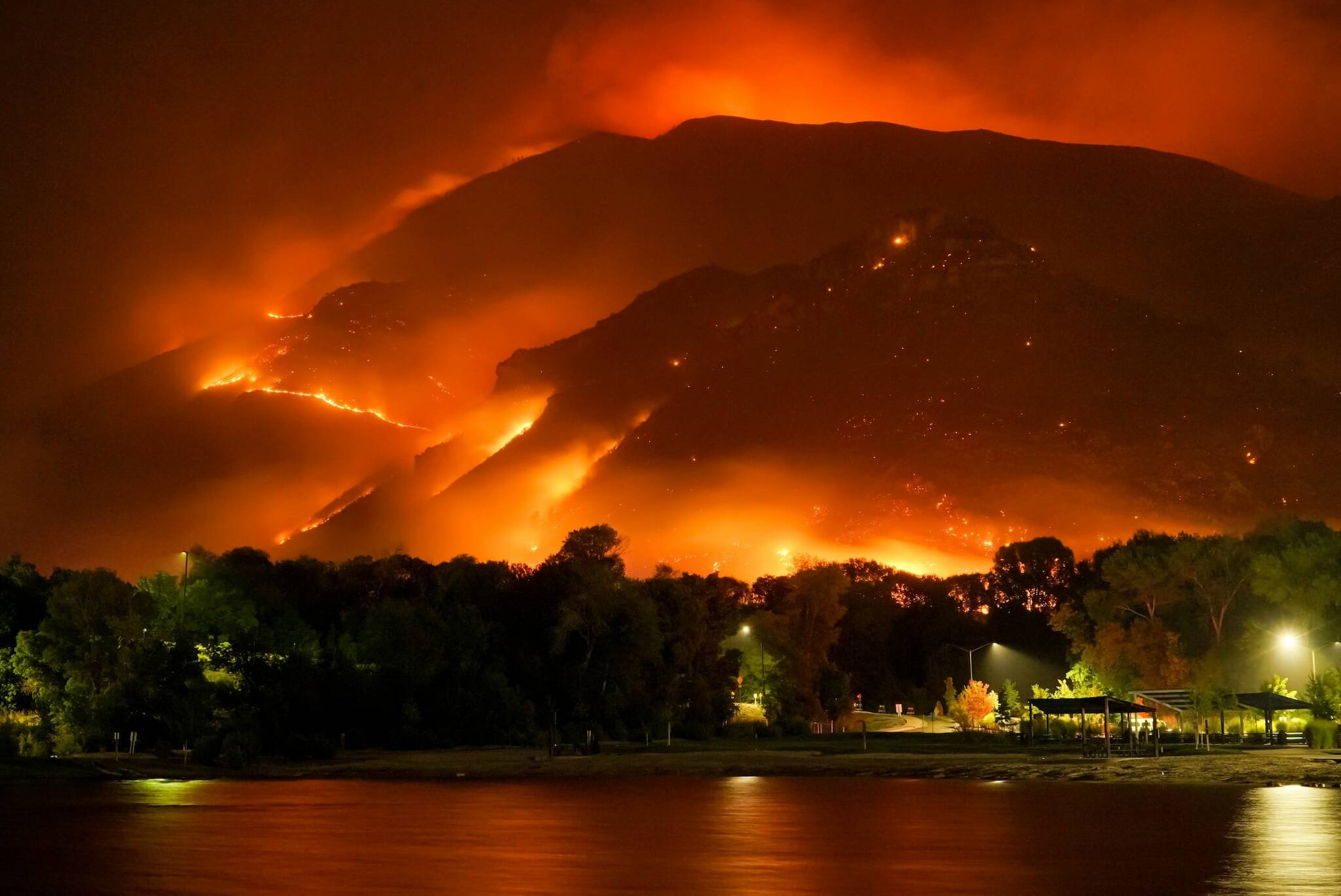 A wildfire engulfs a hillside in this file photo. (Mike Newbry)