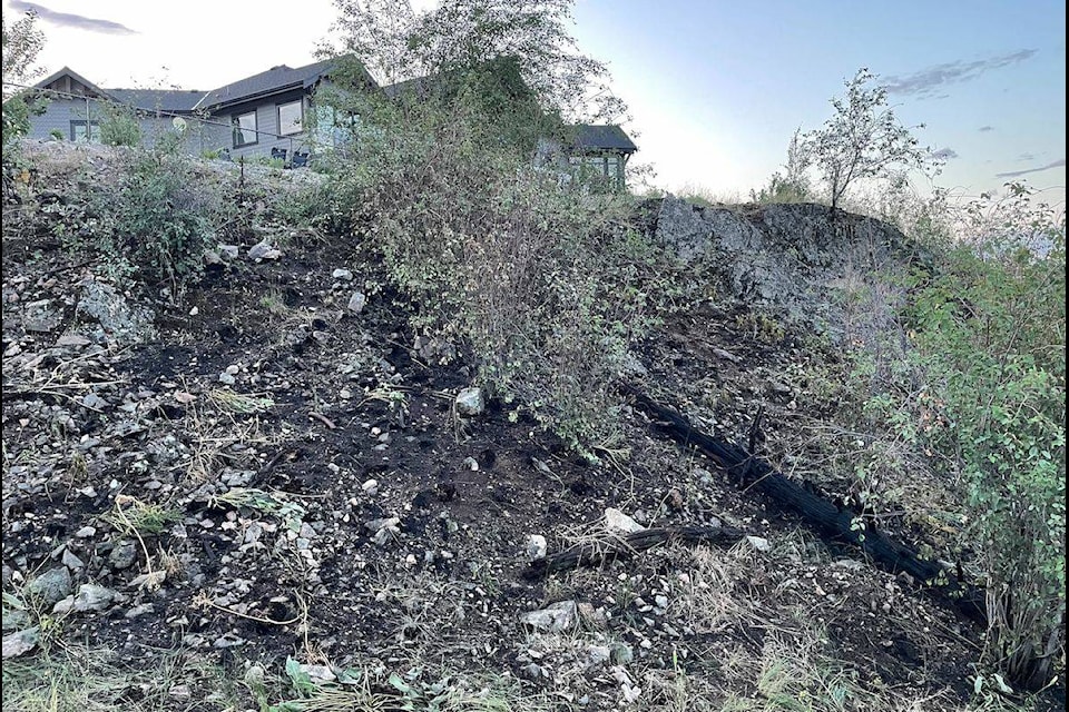 The aftermath of a small bush fire that was found behind a house in The Lakes community in Lake Country. (Jordy Cunningham/Capital News)