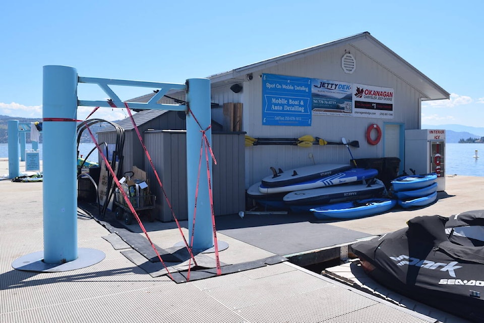 Caution tape has been put up at the Lake Okanagan Resort dock by Okanagan Lake Boat Rentals after a woman fell through a gap in the rubber mats. (Brittany Webster/Capital News)