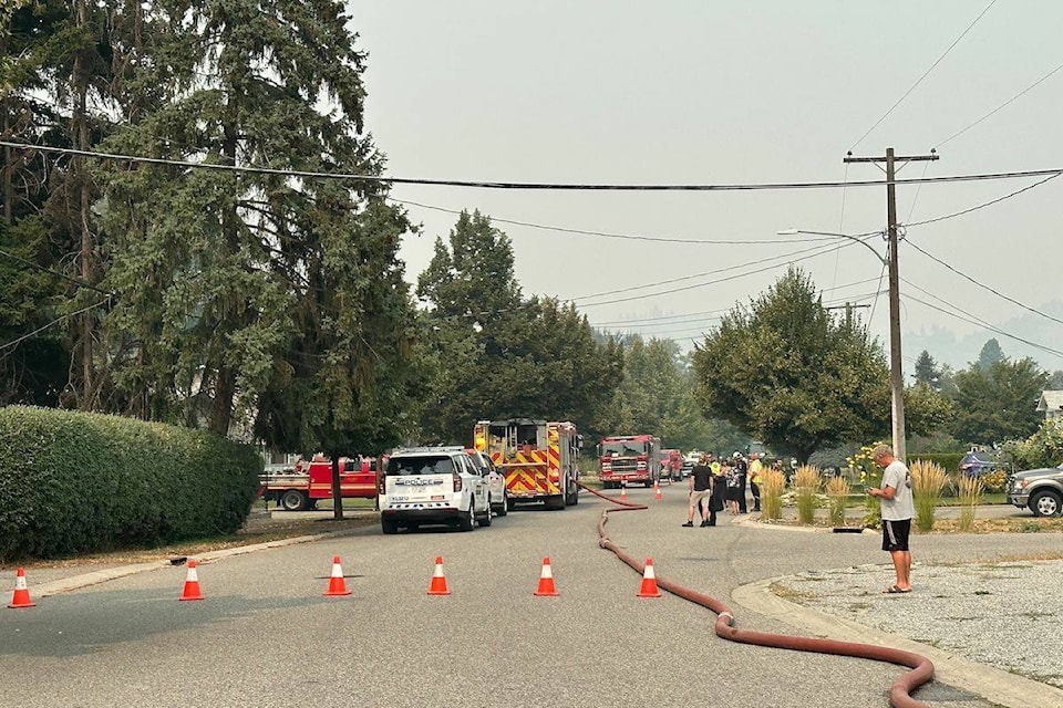Part of Creekside Road is closed to traffic due to a grass fire near the Mission Greenway in Kelowna. (Jordy Cunningham/Capital News)