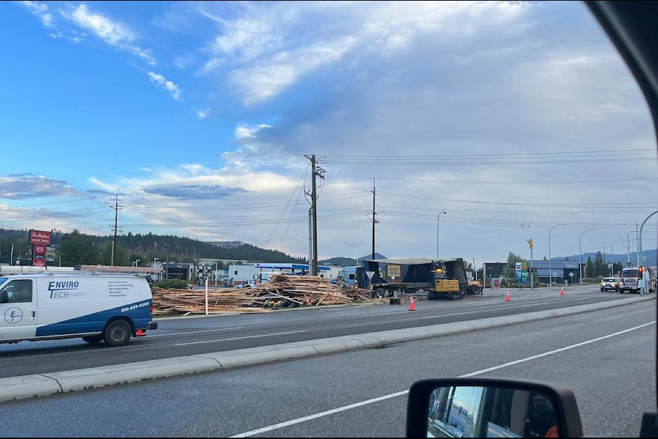 A timber truck spilt all its wood into the Sexsmith Road right turning lane onto Harvey Avenue around 6:45 a.m. Wednesday morning. (Jake Armstrong/Contributed)