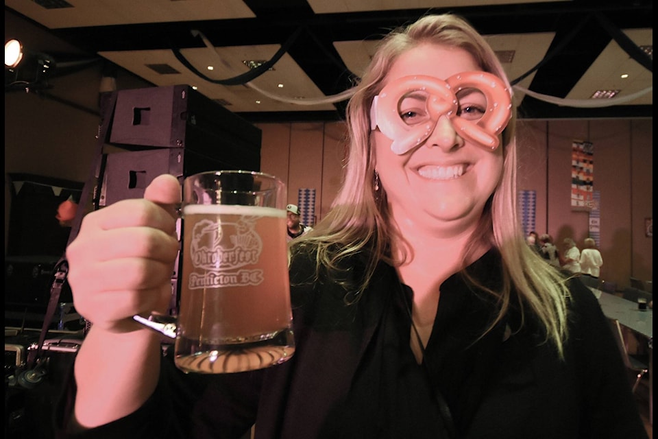 Dayna Rogalsky with her favourite pair of pretzel glasses serves up a toast to the evening. Mark Brett/Western News