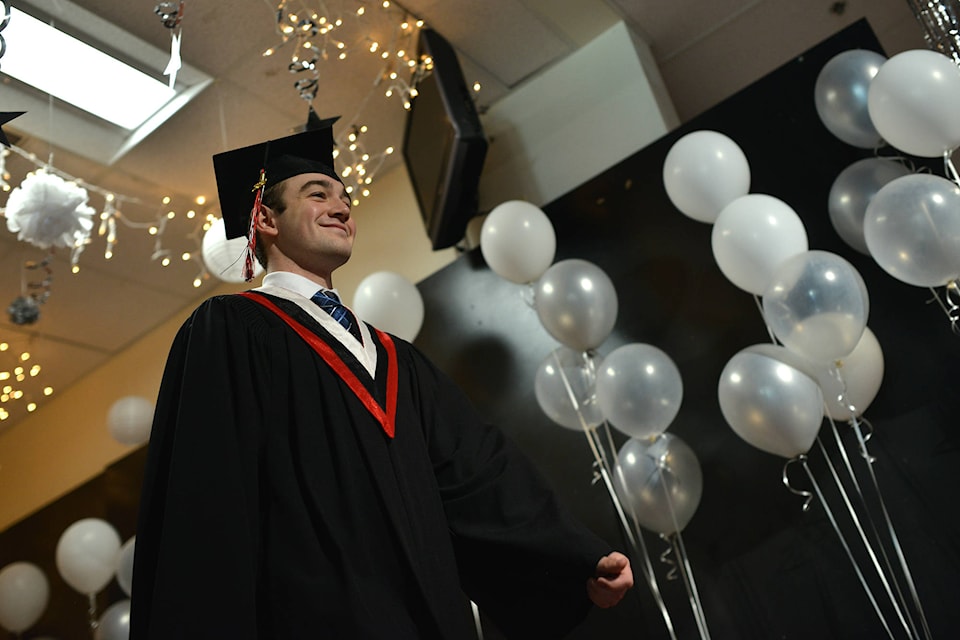 Ten at a time, graduating students cross the stage at Princess Margaret Secondary on Friday, June 19. (Phil McLachlan - Western News)