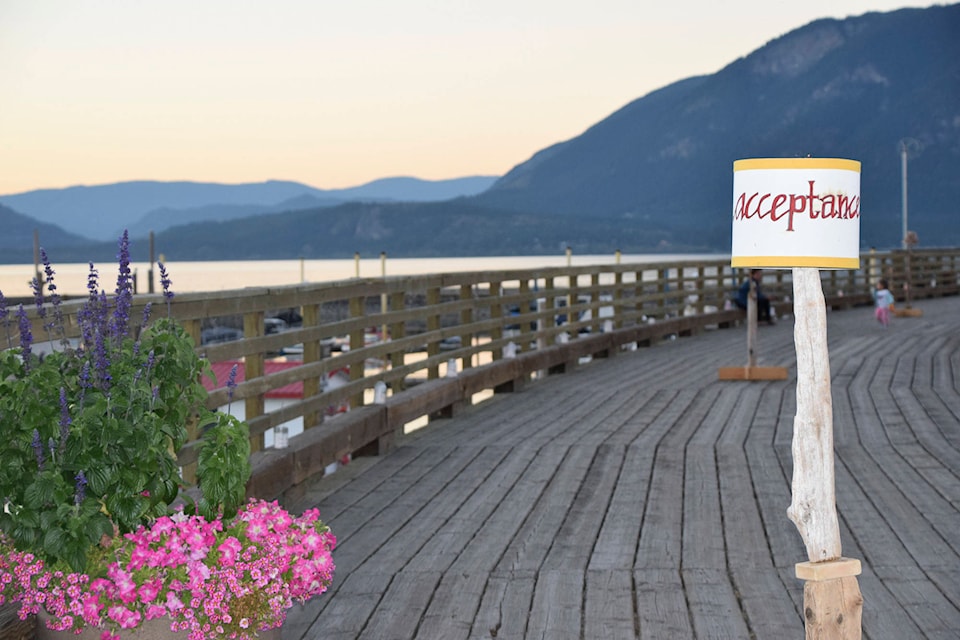 Against a beautiful backdrop, signs of support line the wharf at Marine Peace Park on Thursday night, Sept 10, 2020, during the Walk the Wharf evening to raise awareness of suicide prevention. (Martha Wickett - Salmon Arm Observer)