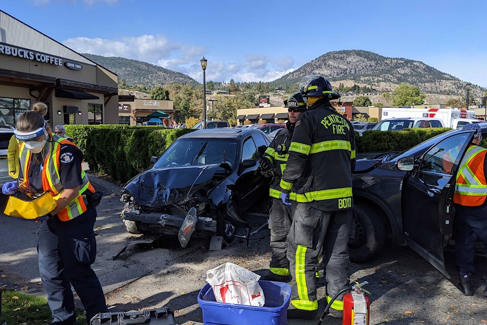 An ‘out of control’ vehicle spun its tires on the highway before colliding with a van on the highway and then a SUV in Penticton’s Riverside Starbucks drive-thru, said witnesses Oct. 15, 2020. (Jesse Day - Western News)