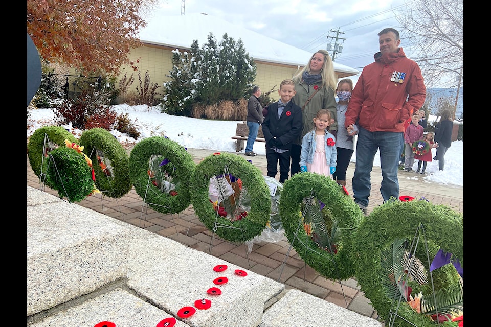 Bosnia and Afghanistan veteran Paul McMillan with his family at the Coldstream Cenotaph Nov. 11. Daughters Marley and Lila, wife Brittany and son Jonah. (Jennifer Smith - Morning Star)