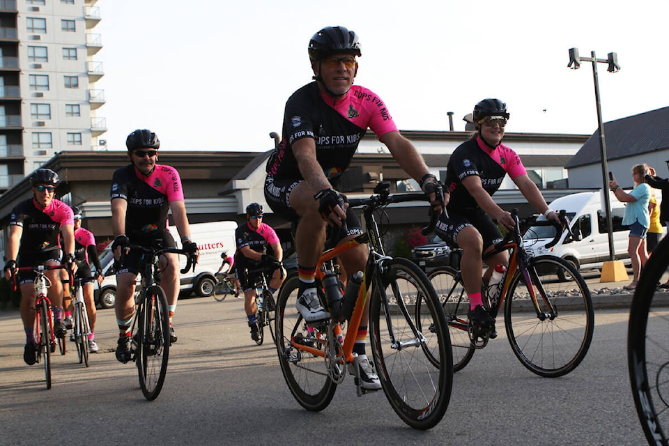 Cyclists depart from the parking lot of Kelowna’s Sandman Hotel on Sept. 10 for the first day of the 21st annual Cops for Kids fundraising campaign. (Aaron Hemens/Capital News)