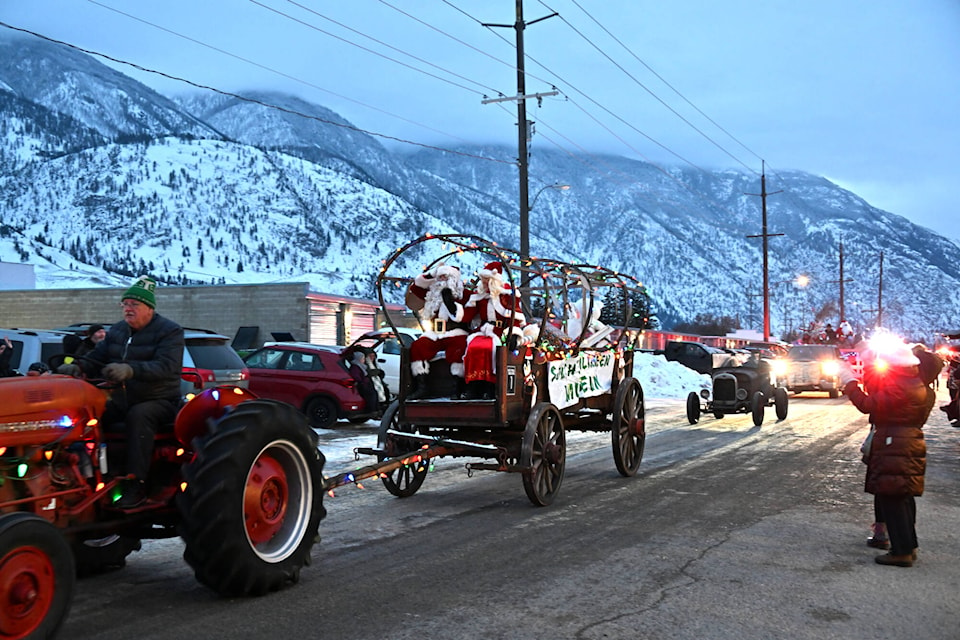 Santa and Mrs. Claus are being pulled by a tractor in the annual Light Up parade in Keremeos on Saturday. (Brennan Phillips Review)