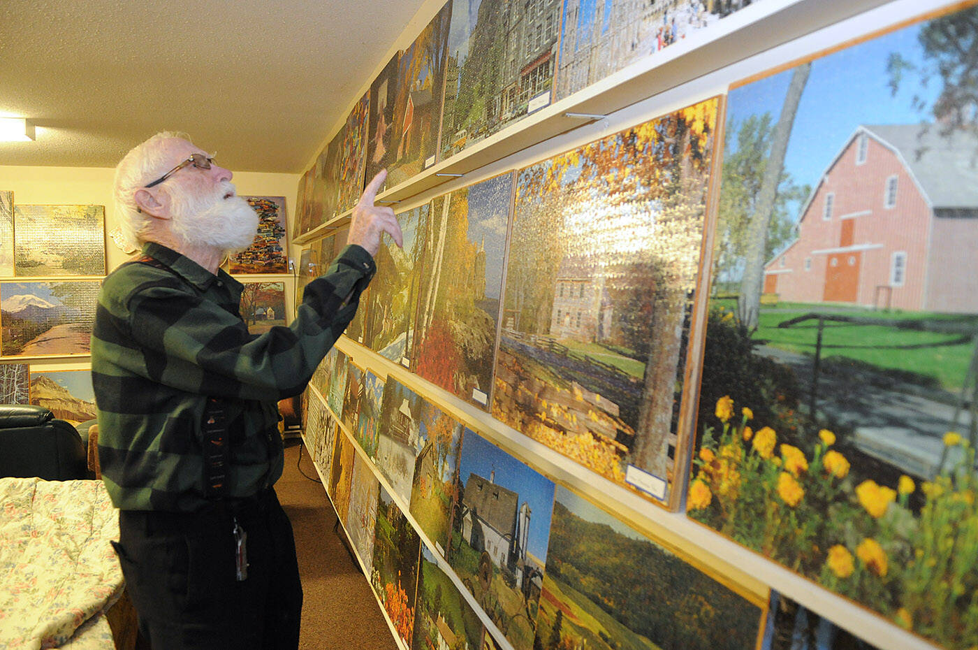 Joe Sommer has completed 190 jigsaw puzzles, all of which are on display in the basement of his Chilliwack home. (Jenna Hauck/ Chilliwack Progress)