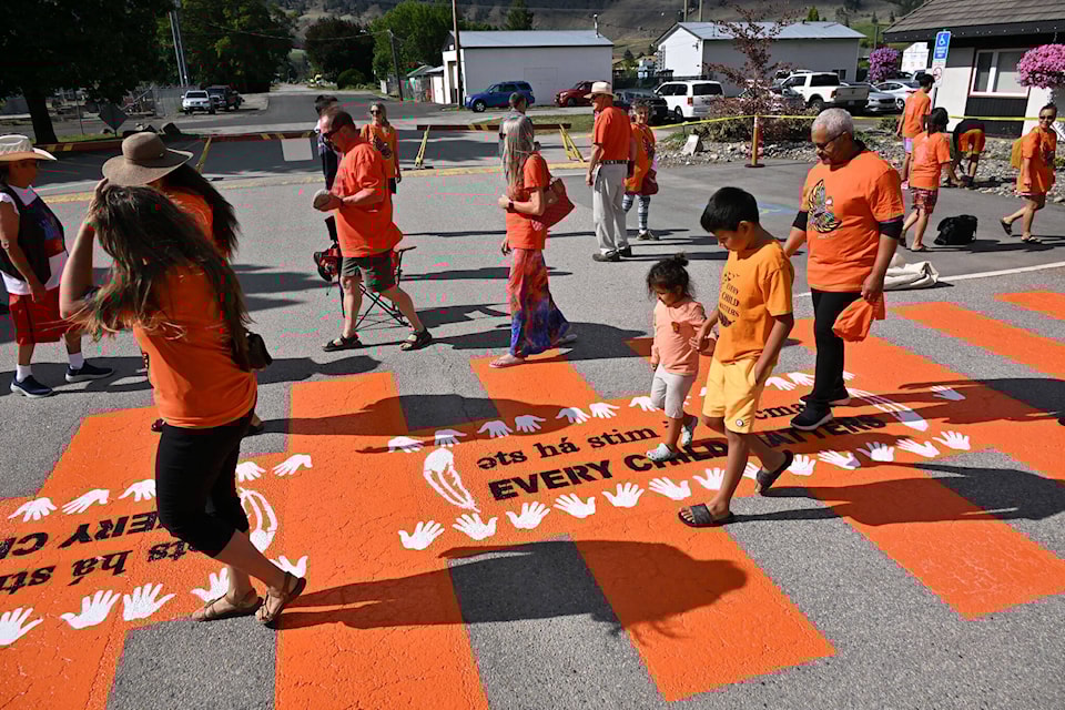 Children walk across the new Every Child Matters crosswalk which was unveiled with a ceremony on July 17. (Brennan Phillips - Keremeos Review)