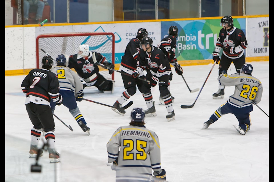 A goal from 100 Mile House's Luke McFarlane finds the top corner and sends Kyan Gray's water bottle flying. 