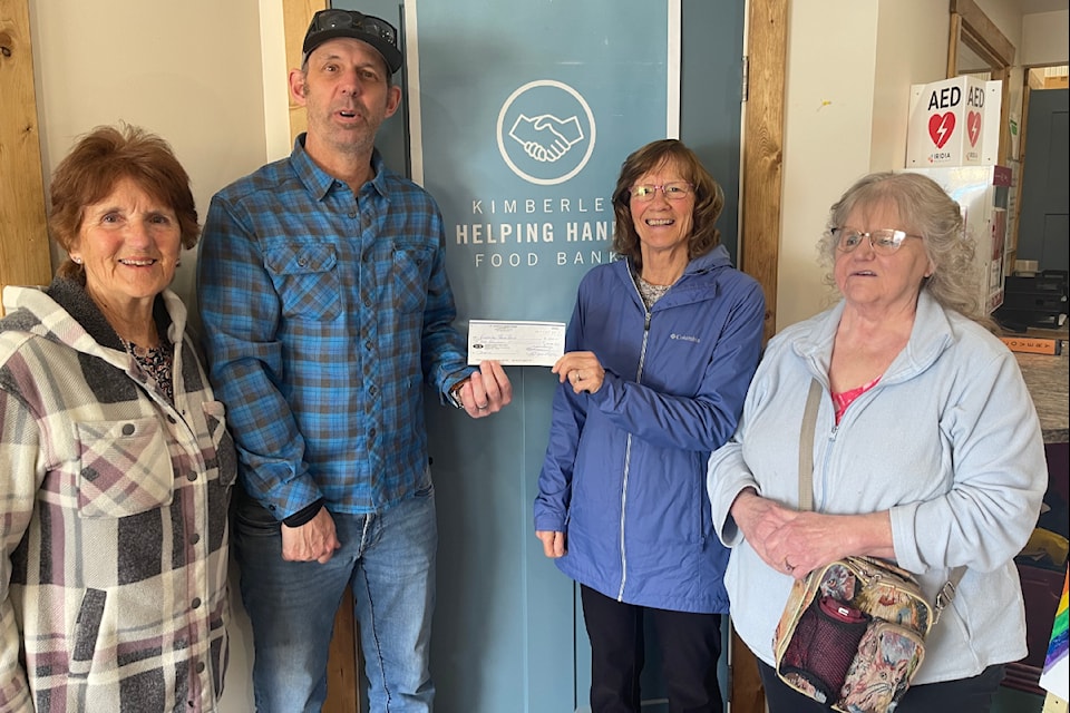 St. Andrew's Presbyterian Church donates to the Kimberley Helping Hands Food Bank. (Left to right) Tina Phillips, Food Bank manager Thom Tarte, Sue Lyons and Beverly Collier. Sandi Hollingshead/Submitted.  
