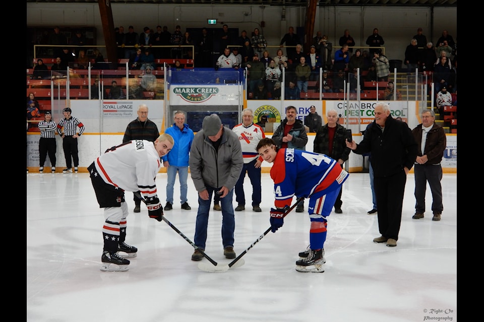 Glen Walton, captain of the '78 Dynamiters, drops the ceremonial first puck to kick off the 2025 Dynamiters playoff run. Jonathan Righton/Submitted.