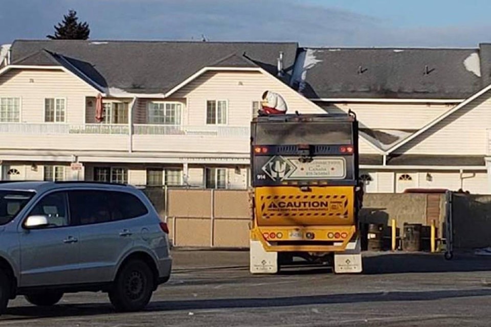 15517618_web1_190212-BPD-M-woman-in-garbage-truck