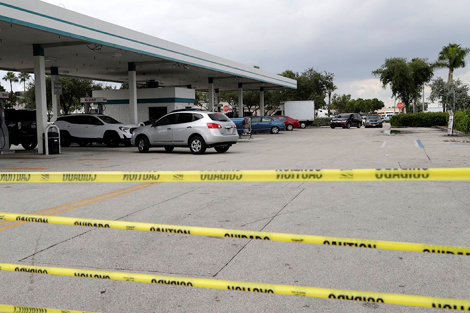 Tape blocks an entrance at BJ’s Wholesale Club to control traffic flow as motorists line up for fuel in preparation for Hurricane Dorian, Thursday, Aug. 29, 2019, in Hialeah, Fla. Hurricane Dorian is heading towards Florida for a possible direct hit on the state over Labor Day. (AP Photo/Lynne Sladky)