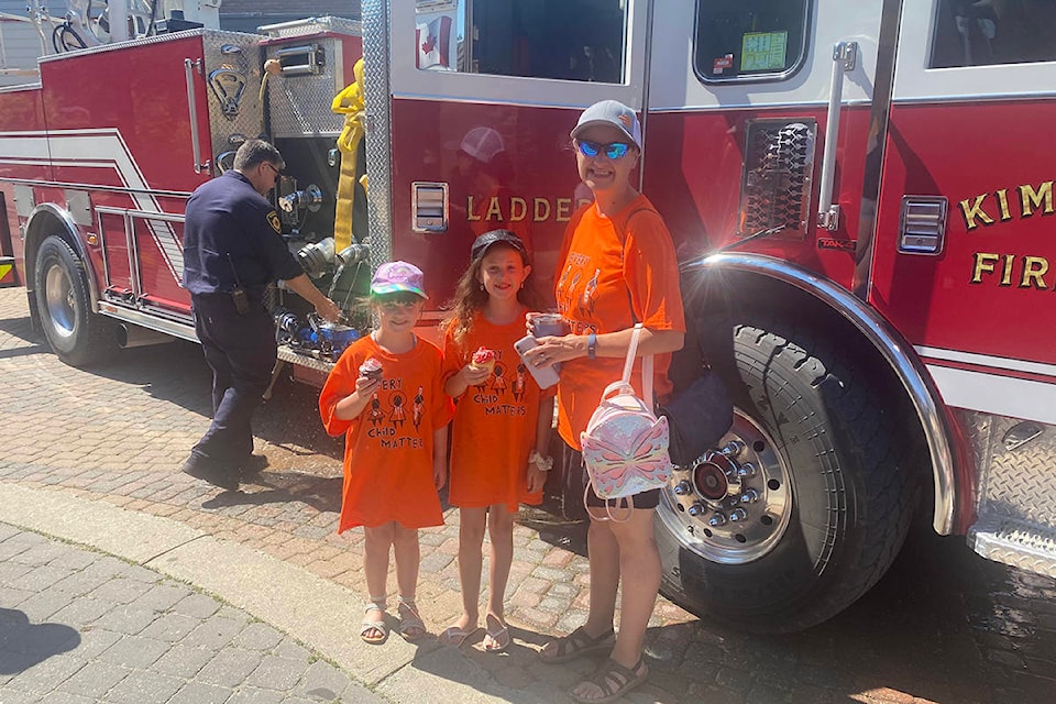 Nikkela, Adi and Brianna Young don orange “Every Child Matters,” commemorating all the children who attended residential schools across the country. Paul Rodgers photo.