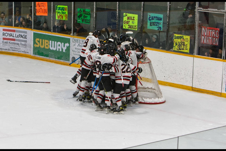 The Dynamiters celebrate their unbelievable win. Paul Rodgers photo.