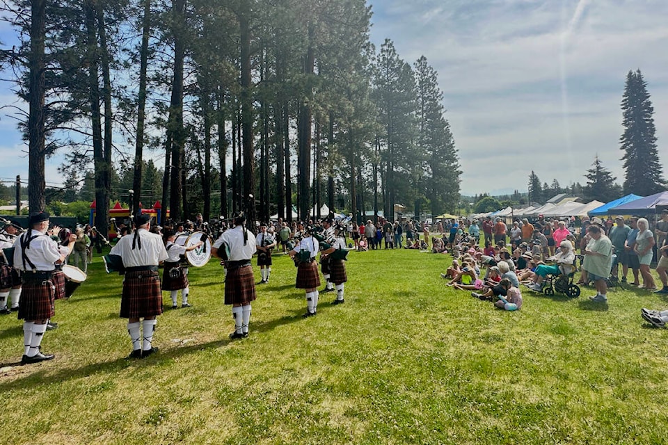 The crowd at Marysville Daze enjoys the Kimberley Pipe Band. Paul Rodgers photo.