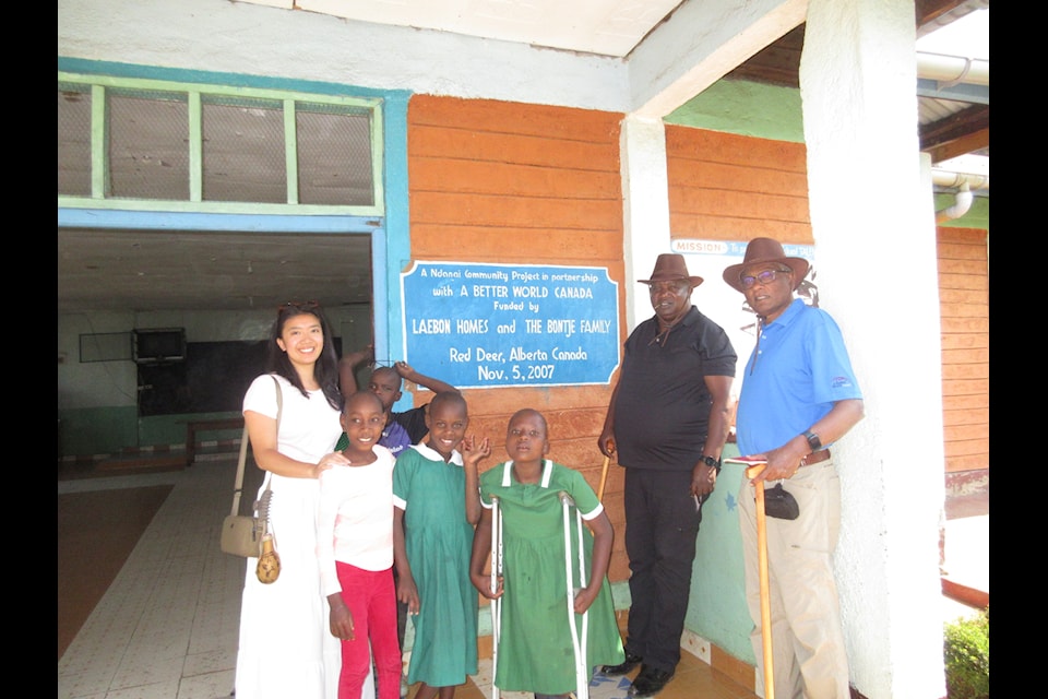 At left is Burman University student Anna Flores on a trip to visit projects.
Far right is Eric Rajah, co-founder of A Better World, and next to him is Lawrence Mathea, A Better World's Kenya project manager.
(Photo submitted)                    