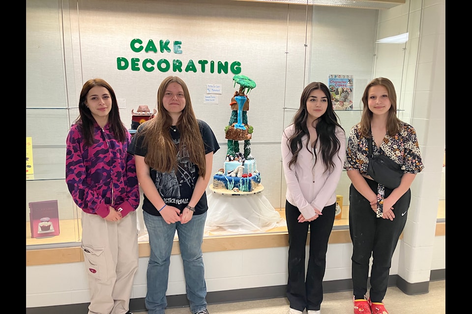 Lacombe Composite High School students Jessica Nicolas, Savanna Kettle, Miji Mahmood, and Katheryn Kettle created a cake conveying elements of the natural world.
(Mark Weber/Lacombe Express)