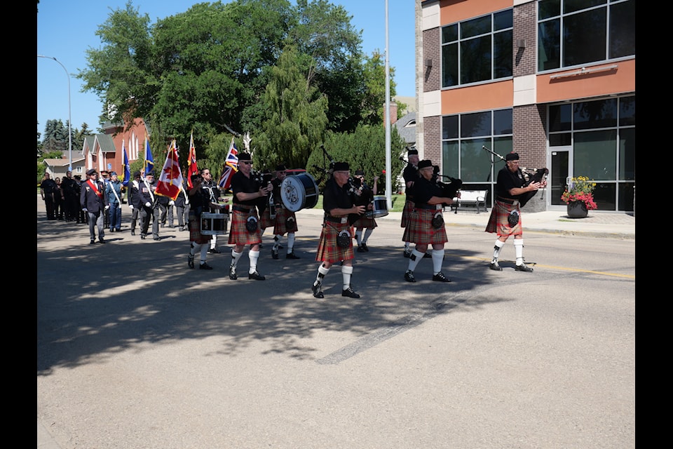 Members of the Red Deer and District Pipe Band led the march from the Lacombe Memorial Centre to the Lacombe Legion on Canada Day. 