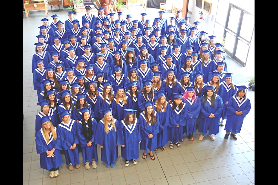 On Monday, June 23 the Grade 12 class of Ladysmith Secondary School held a rehearsal for their graduation ceremony the next day. The happy students gathered in the school foyer for a group shot in their cap and gowns. 