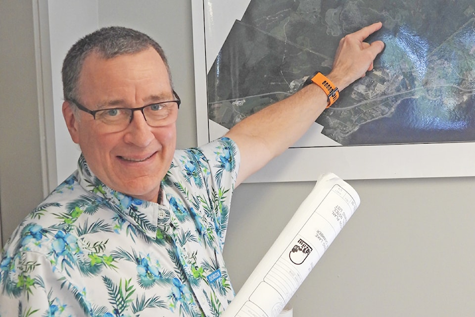 Pointing to the Town of Ladysmith’s main water supply, the Director of Infrastructure Tim Tanton points out Holland Lake and future plans for the ongoing process of preserving and enhancing the town’s water supply. (Duck Paterson photo)