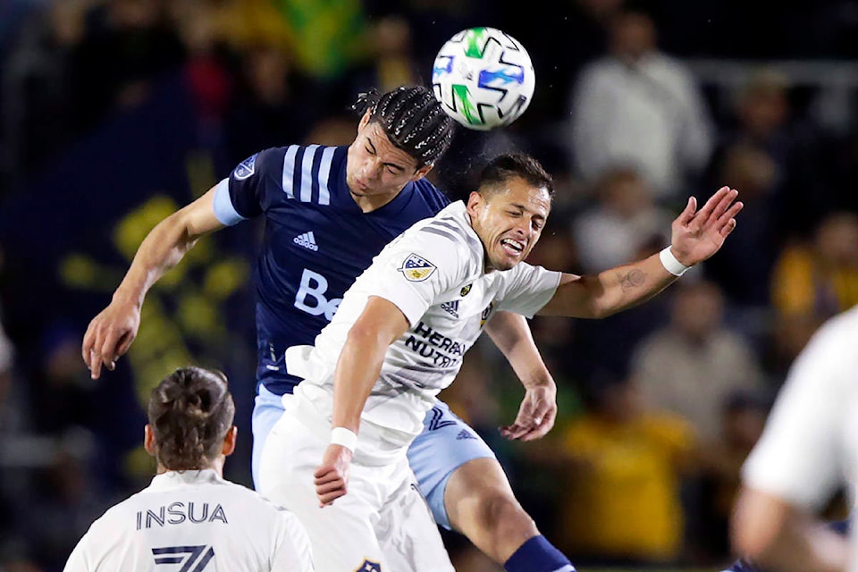 20846792_web1_200307-IFD-MLS-Whitecaps-Galaxy-caps_1