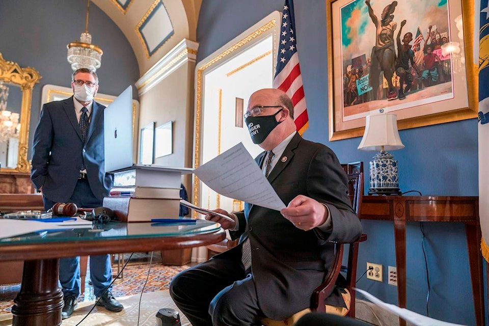 House Rules Committee Chairman Jim McGovern, D-Mass., right, leads a partially-virtual hearing to consider a resolution calling on Vice President Mike Pence to activate the 25th Amendment to declare President Donald Trump incapable of executing the duties of his office, at the Capitol in Washington, Tuesday, Jan. 12, 2021. House Speaker Nancy Pelosi, D-Calif., is calling for swift congressional action to rein in President Donald Trump after inciting last week’s deadly assault on the U.S. Capitol. (AP Photo/J. Scott Applewhite)