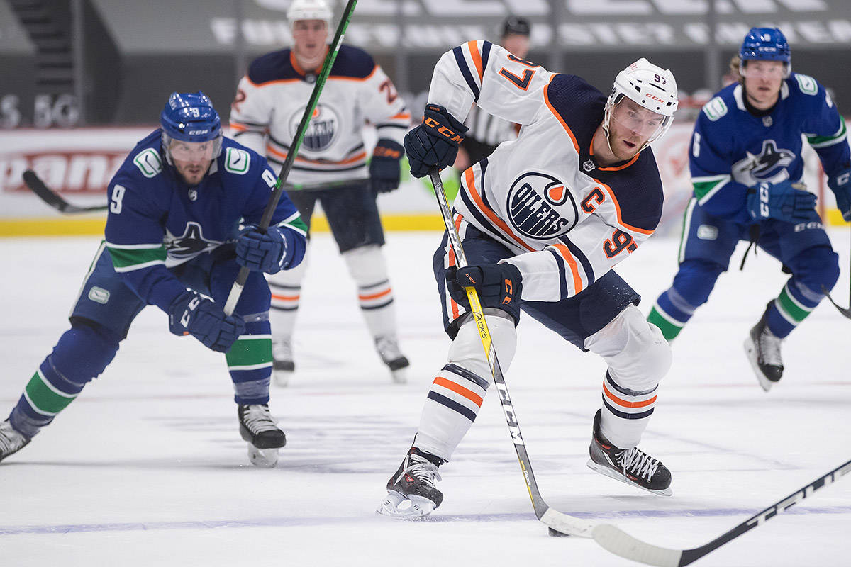 McDavid has 4 points, Oilers clinch playoff spot with 5-3 win over Canucks 