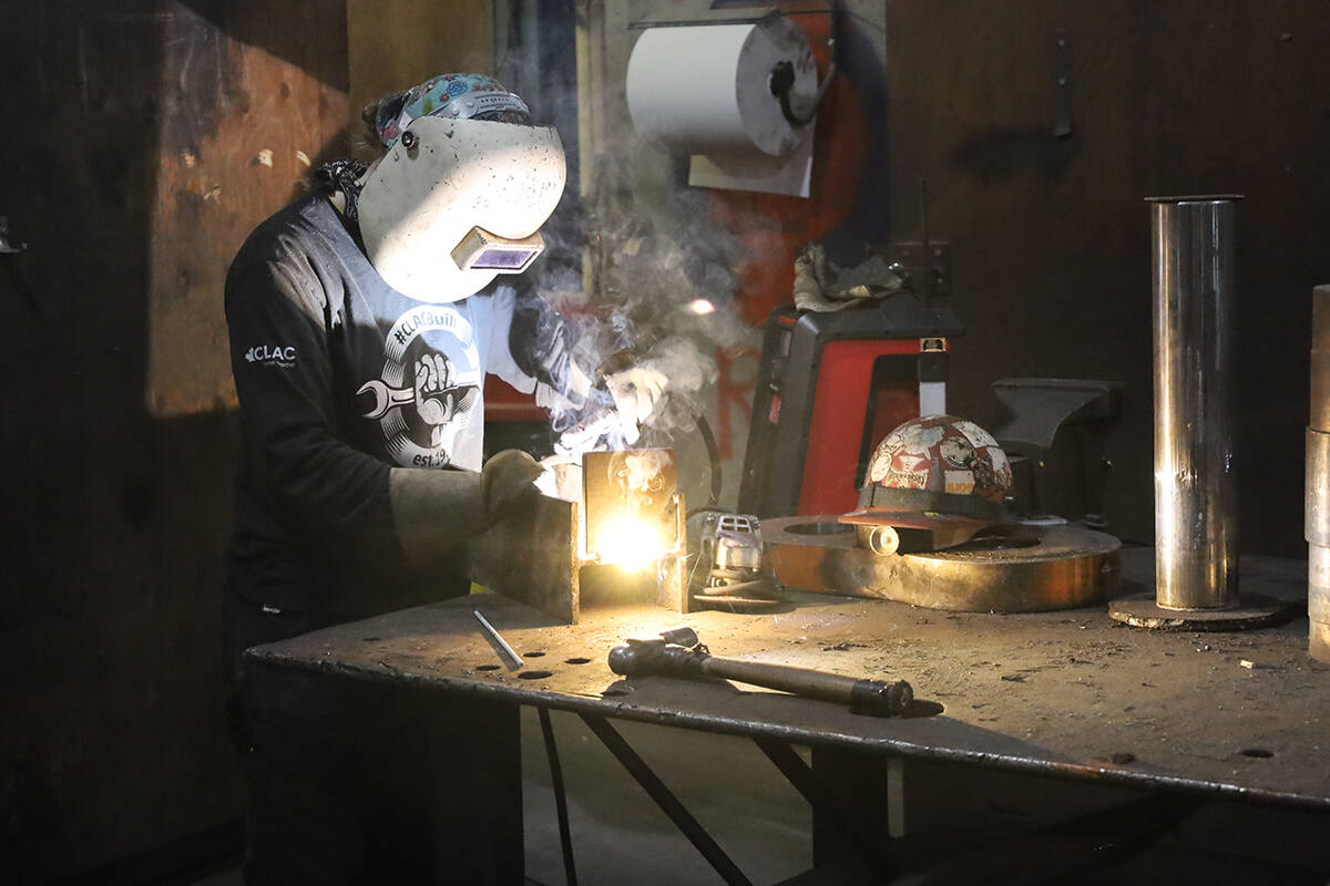 Ashley Davison repairs equipment at the Teal Jones mill in Surrey. Teal Jones employs over 1,000 people across BC. Shawn Hall Photo.