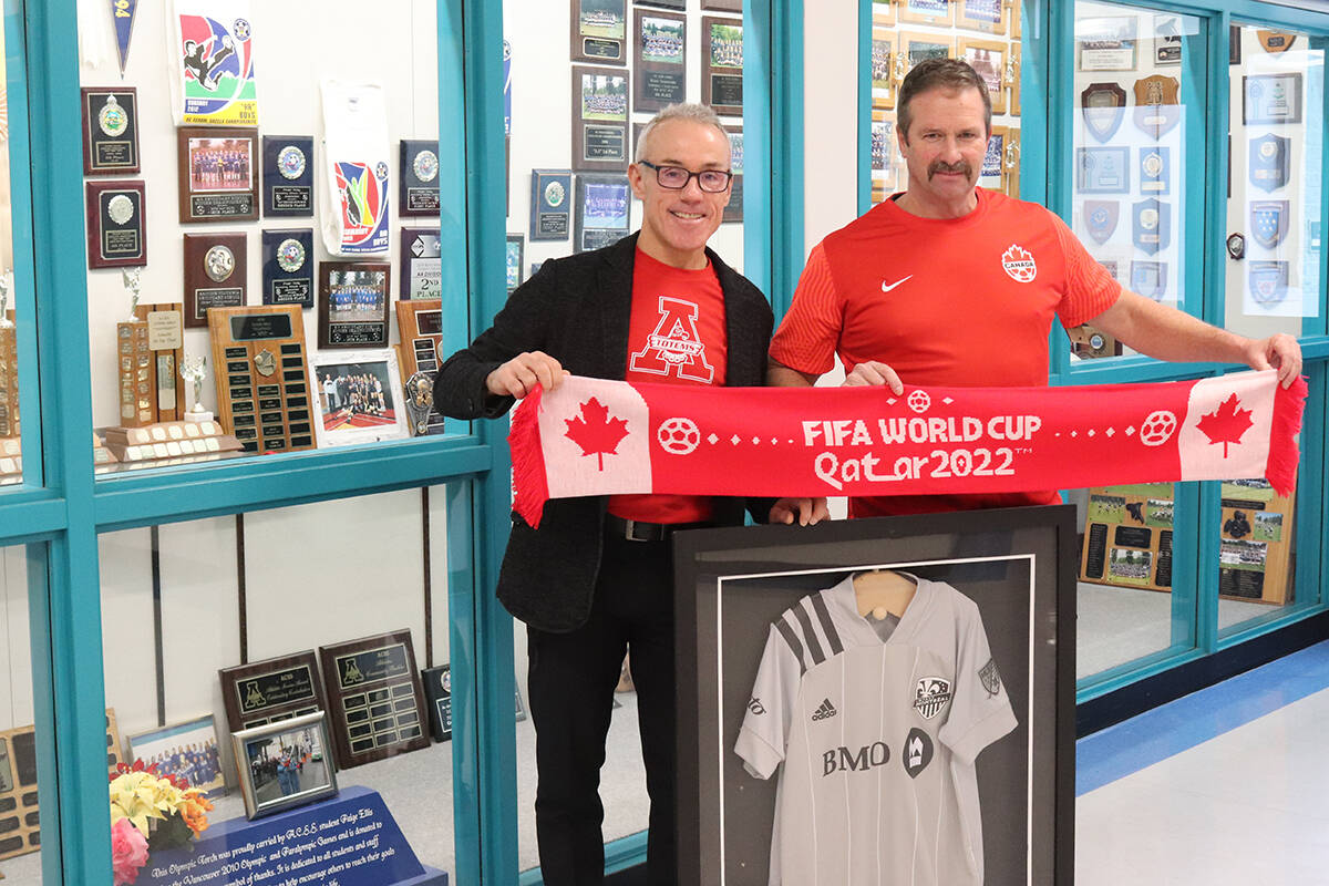 Aldergrove Community Secondary School principal Mike Palichuk (left) and former ACSS soccer coach Brian Hunter stand with former student Joel Watermans Montreal soccer jersey, which hangs in the schools Athletics Wall of Fame. (Special to Langley Advance Times)