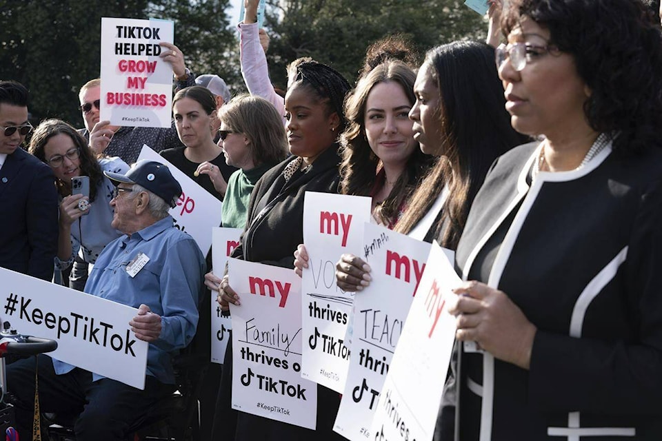 Supporters of TikTok hold signs during a rally to defend the app, Wednesday, March 22, 2023, at the Capitol in Washington. The House holds a hearing Thursday, with TikTok CEO Shou Zi Chew about the platform’s consumer privacy and data security practices and impact on kids. (AP Photo/Jose Luis Magana)