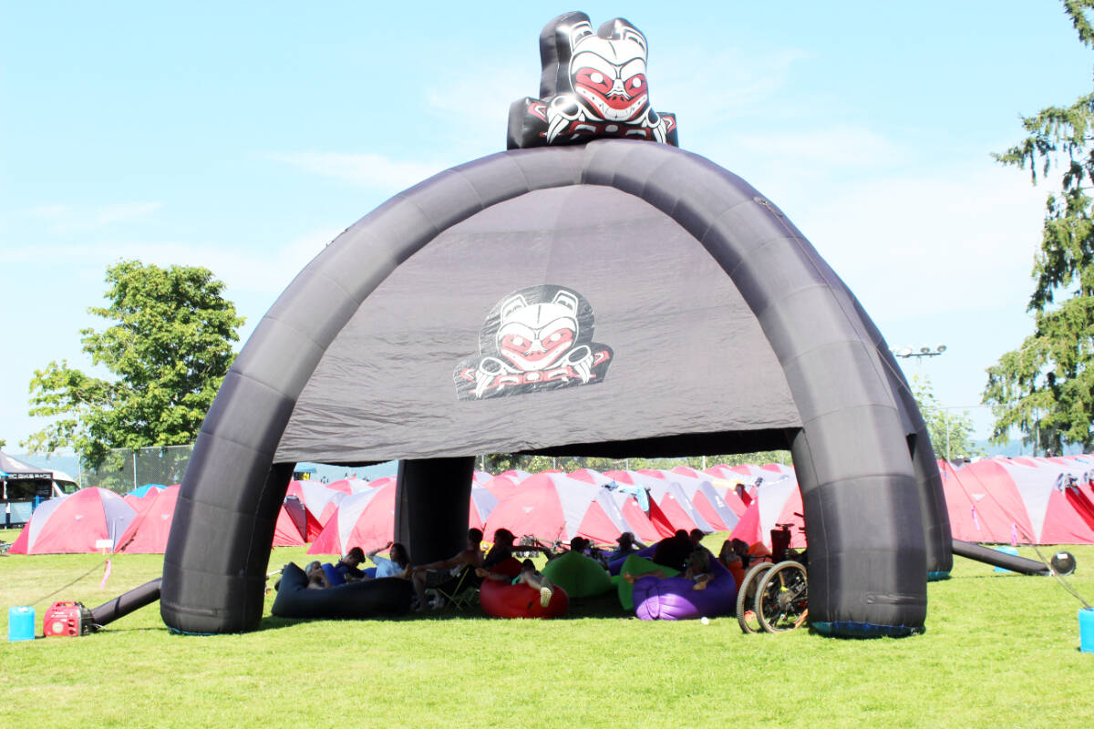 There was limited space available for shade at the Crofton base camp for the BC Bike Race. Riders lounge around in every available shady spot after a gruelling and hot third day on the course in Crofton. (Photo by Don Bodger)