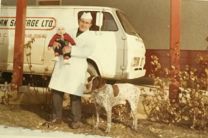 Helmut West, pictured holding his daughter Doris, founded Okanagan Sausage in 1967. (Submitted Photo)