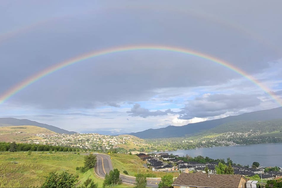 Randy Szasz shared this photo of a rainbow over Kalamalka Lake looking toward the Coldstream valley July 9, 2020. (Randy Szasz - Facebook)