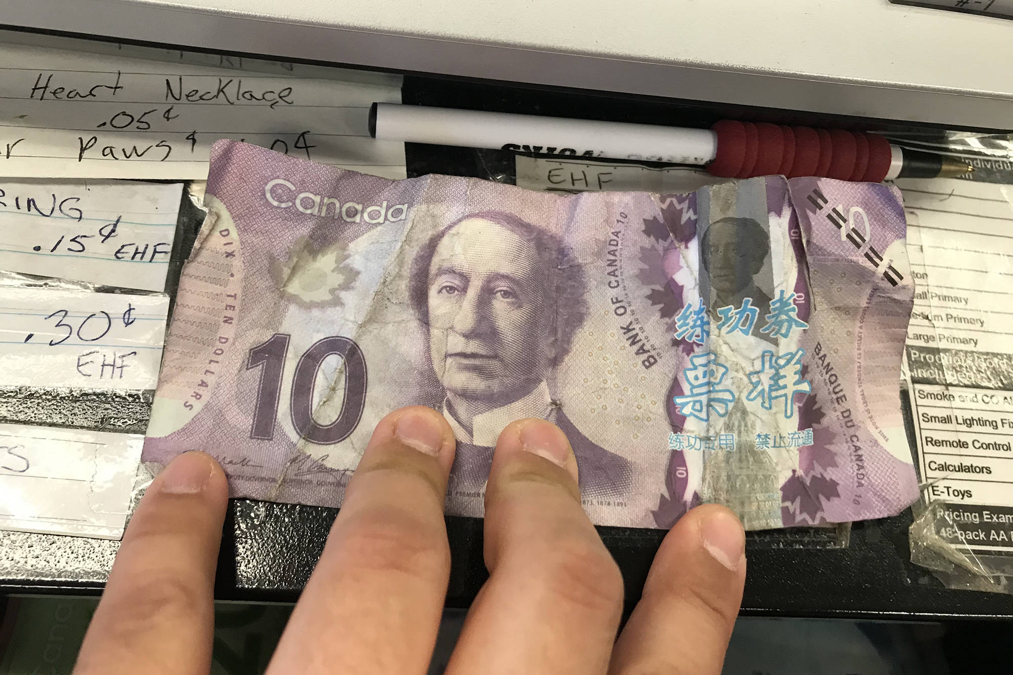 Fake 10 store dollar bill