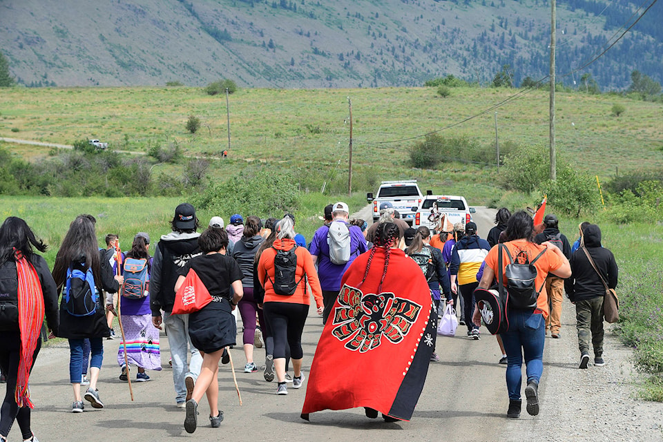 25582272_web1_210618-SAA-walking-spirits-red-cape