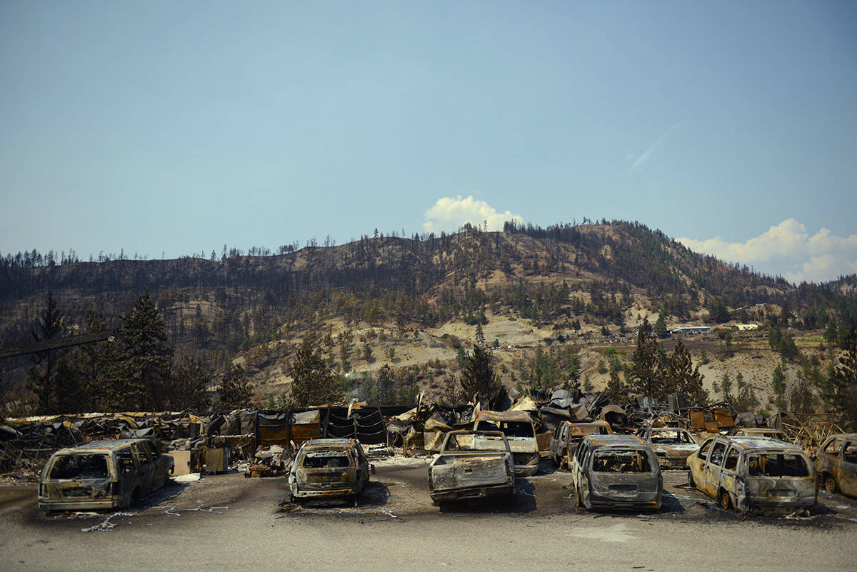 A row of burnt cars parked along Highway 1, just outside the Village of Lytton, B.C. on Friday, July 9, 2021 following a massive wildfire that tore through the town destroying 90 per cent of it. (Jenna Hauck/ Black Press Media)