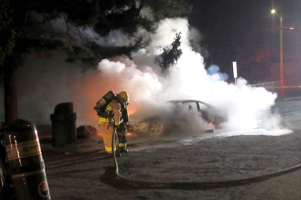 Lumby firefighters extinguish a car fire near the skatepark, after it was allegedly stolen early Wednesday, Sept. 29. (Derrick Hiebert photo)