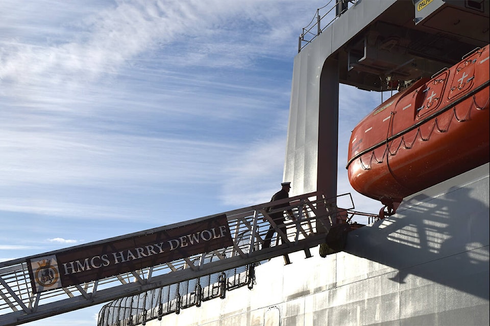 An officer boards HMCS Harry DeWolf after docking at Ogden Point. Oct. 3. (Kiernan Green/News Staff)