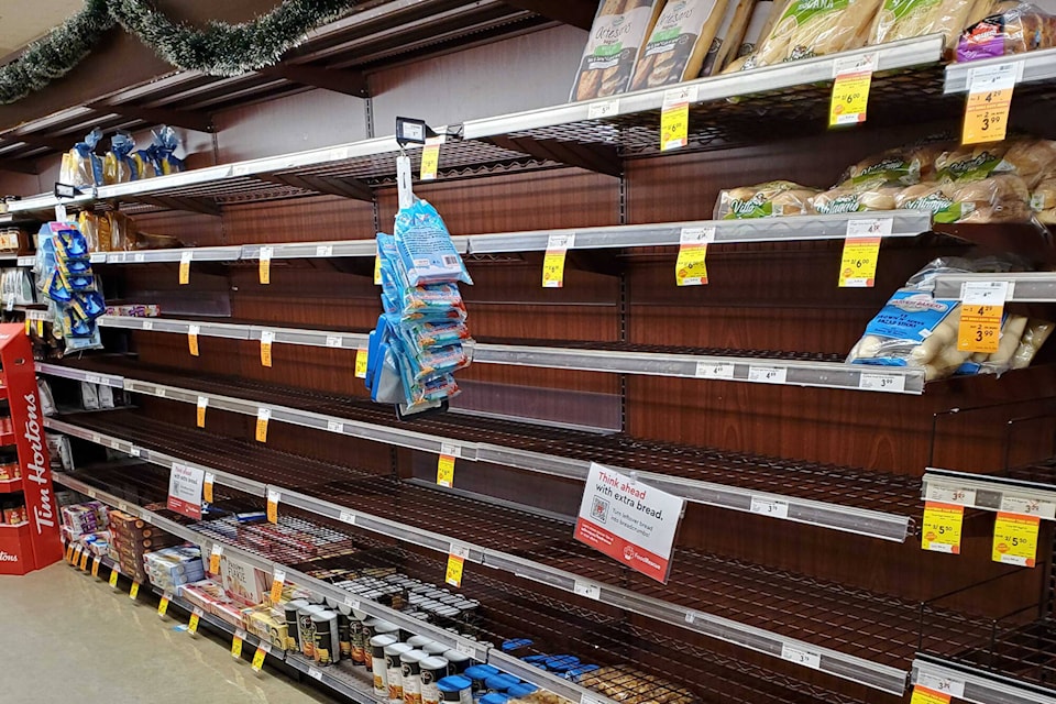 Empty shelves at local grocery stores are a result of people panic buying while supply chains are severed due to flooding and slides. (Roger Knox - Morning Star)