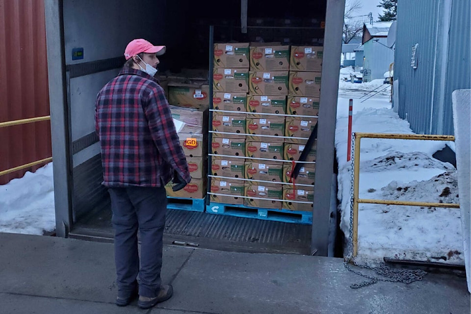 (Aussie) Dave Henry of the North Okanagan Valley Gleaners Society prepares to unload a truckload of donated produce from an Edmonton farm, including bananas for the first time ever. (Roger Knox - Morning Star)