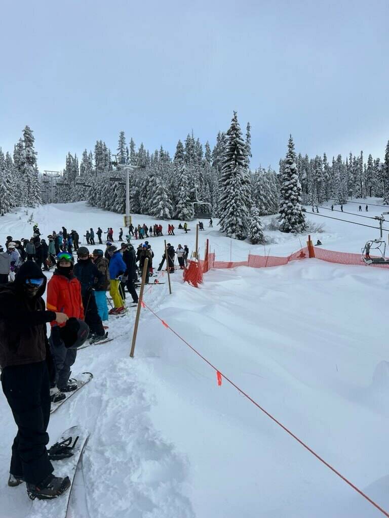 Long lines are shown on Jan. 19 at Big White as lifts run on backup generators. (Submitted)