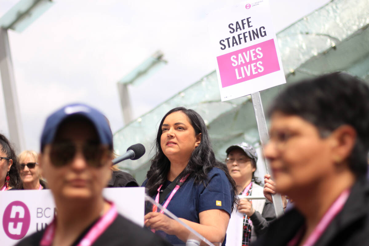 B.C. Nurses Union president Aman Grewal speaks at a protest Wednesday (May 31, 2023) that saw hundreds of nurses in town for a BCNU conference march along the streets of Vancouver calling for safer staffing levels. (Lauren Collins)