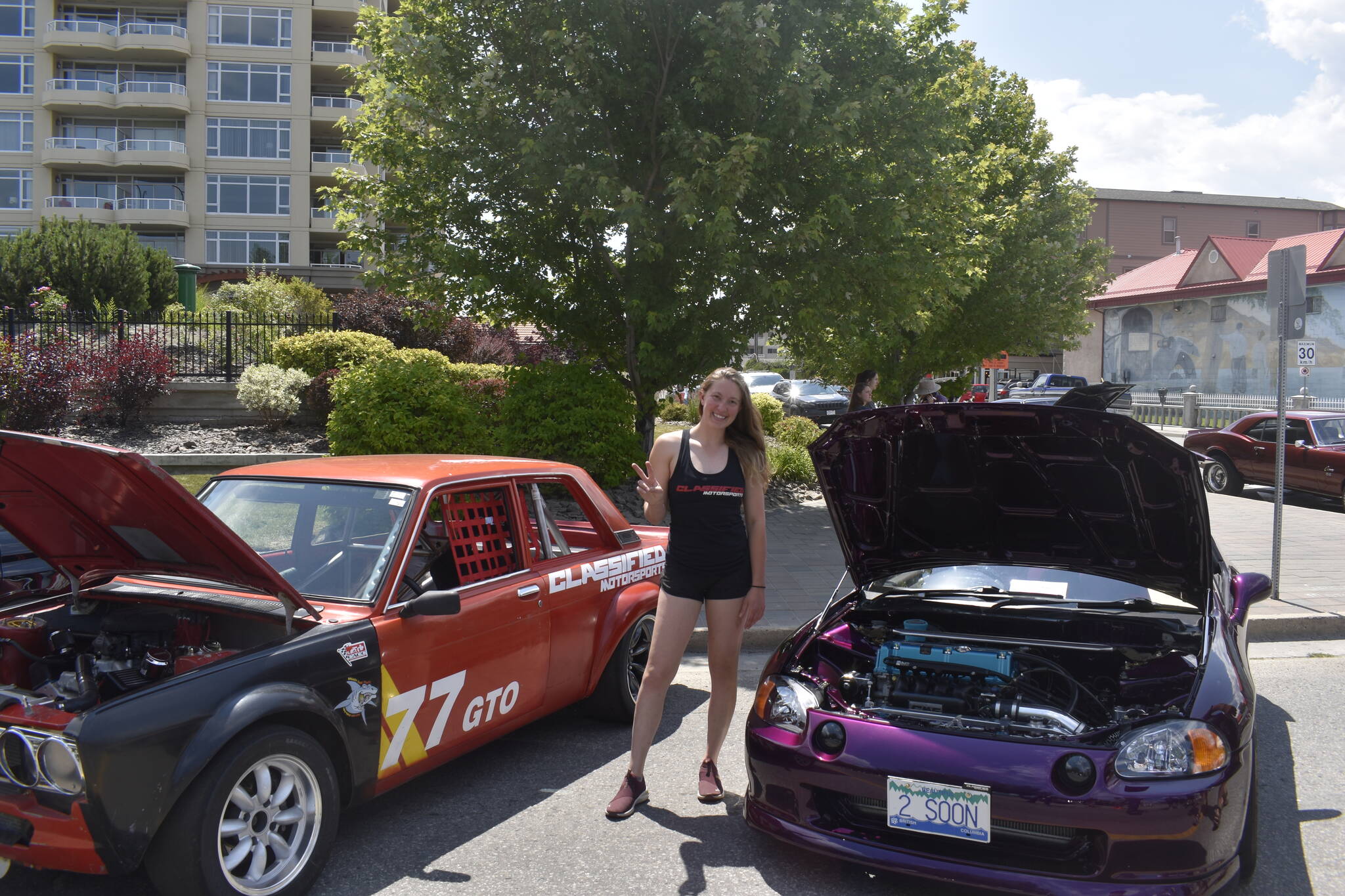 Justine Boyer with her car on the right, as well as her fathers on the left, representing Classified Motorsports in Kelowna. (Logan Lockhart/Black Press)