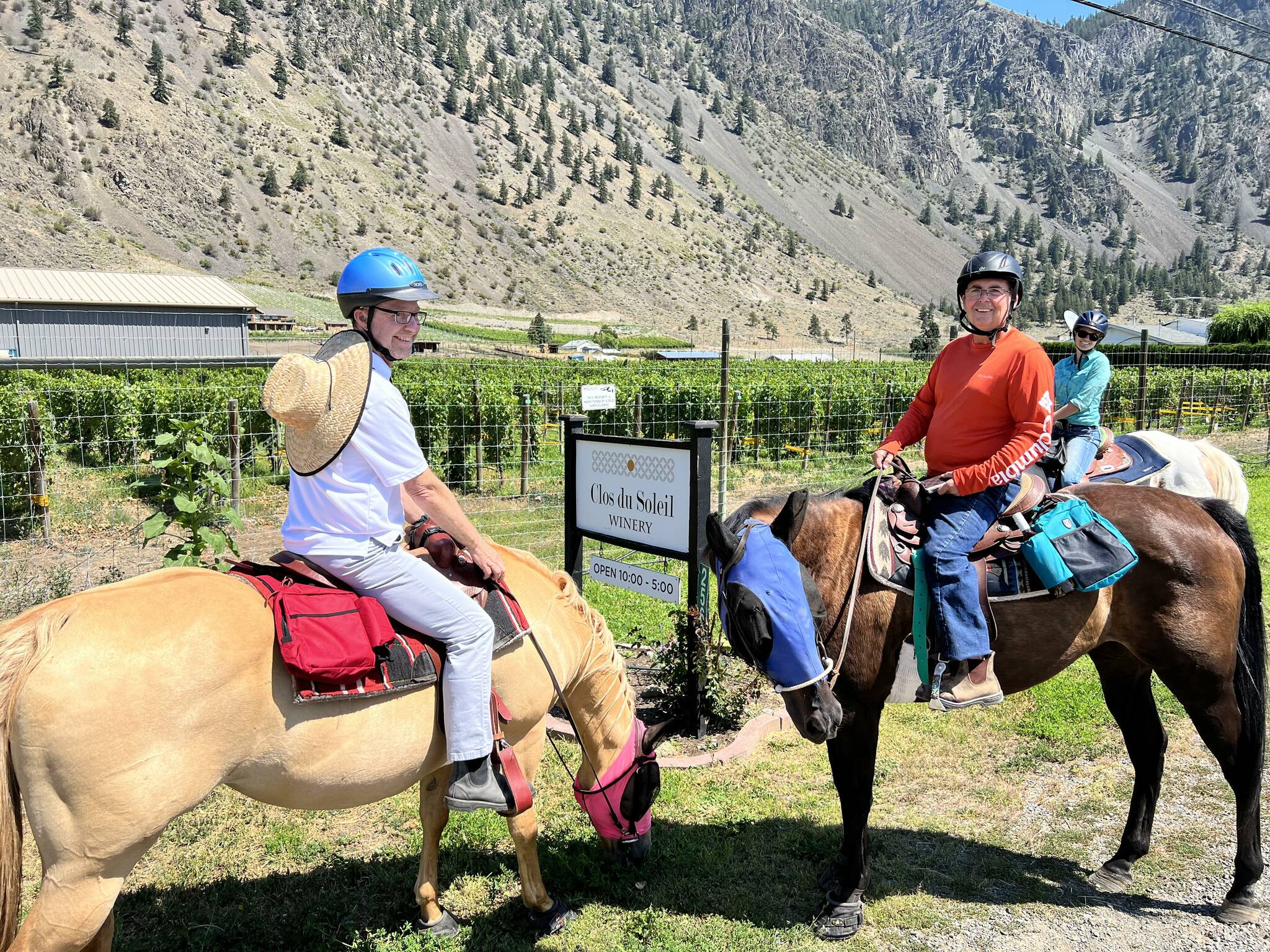 Riders enjoying a stop at a Similkameen winery (notice the wine bottle in the saddle bag. (Submitted)