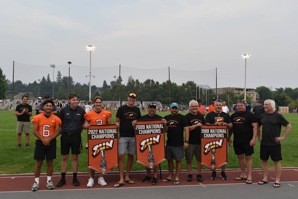 The Okanagan Sun honoured their storied past by raised banners for the franchise’s three national titles before the 2023 home opener at the Apple Bowl on Saturday night, Aug. 5. (Jordy Cunningham/Capital News)