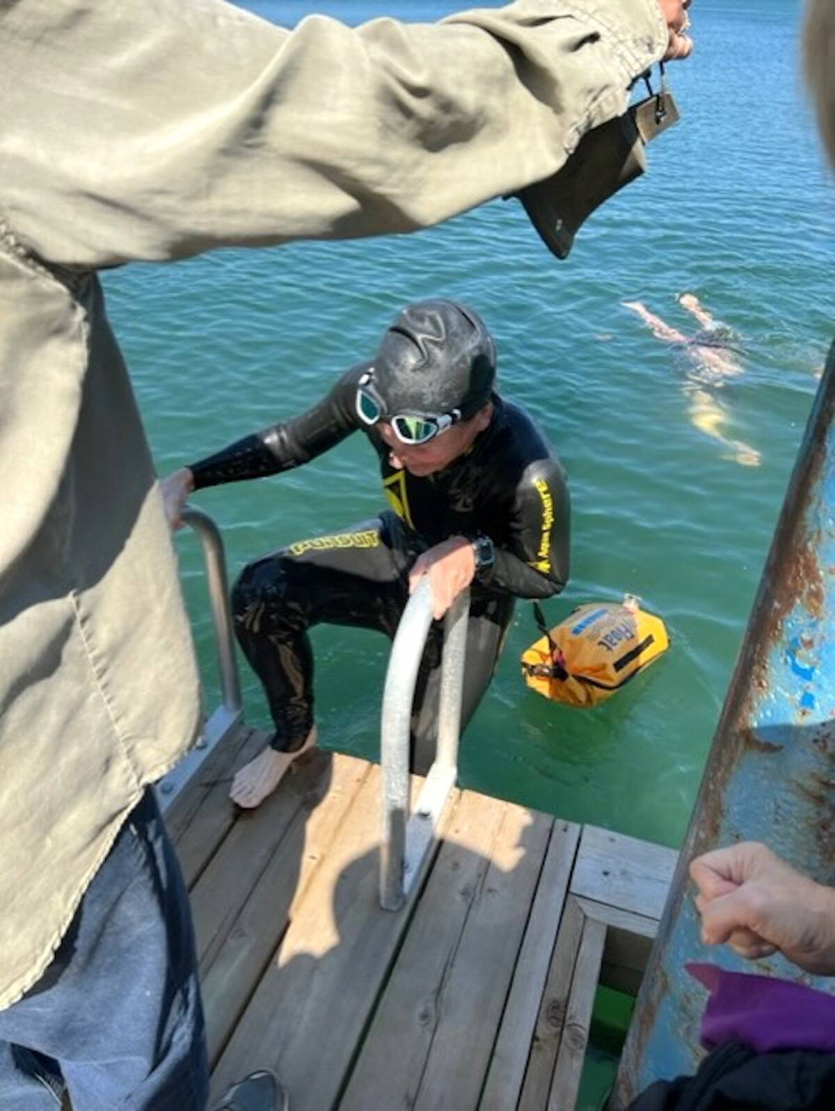 Jen Soti steps out of the water at the end of her 15-kilometre swim at Harrison Lake on Thursday, Aug. 17, 2023. (Contributed photo)